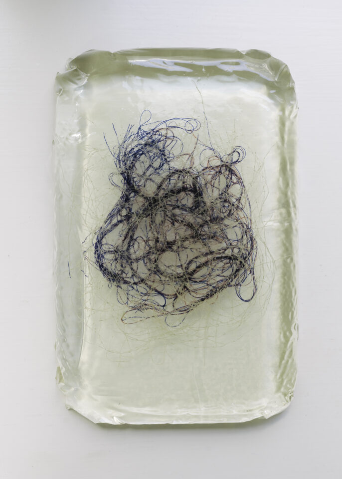 15 Marie Hazard_messofthreadsinresin_2020_27x17cm_Polyester_threads in resin.jpg