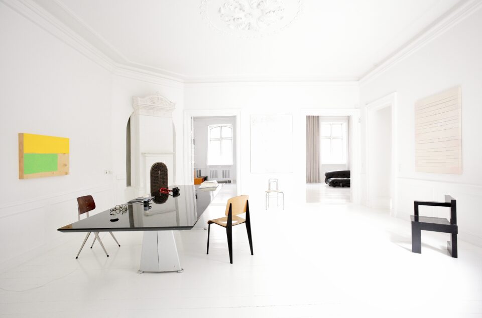 Jean Prouve desk and chair, surrounded by art in a Gallery in Copenhagen