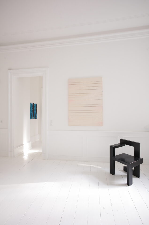 steltman chair in front of painting by Luke Diiorio